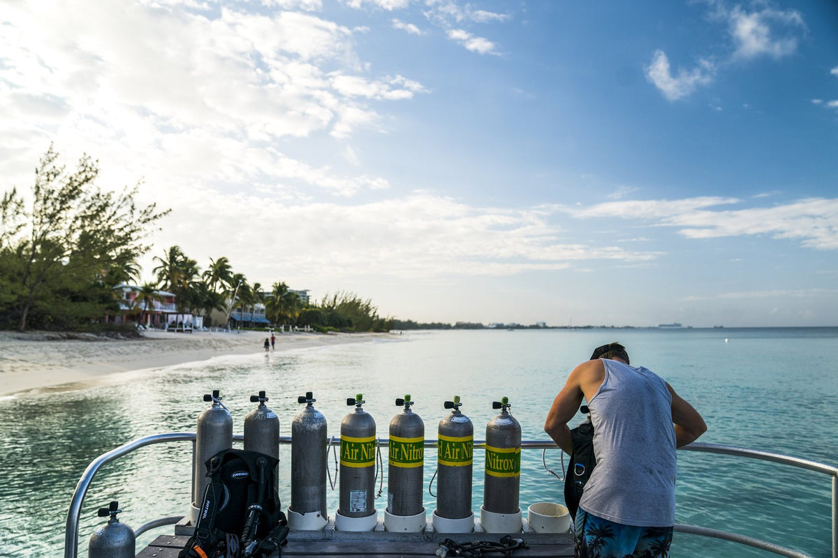 Scuba cylinders lined up on a boat deck