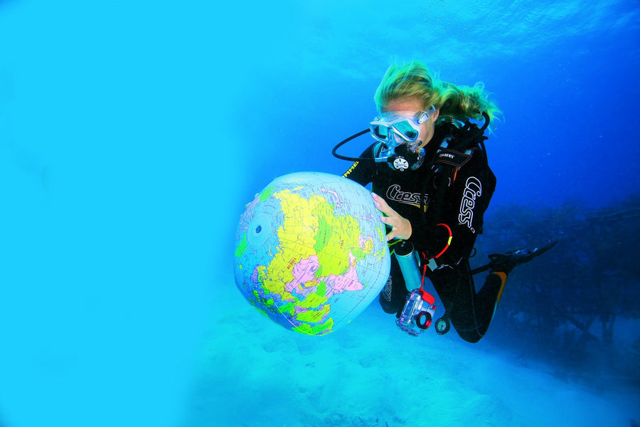 Diver with an inflatable ball underwater