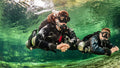 Sidemount diver in green water